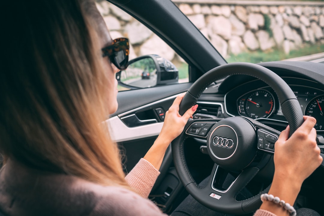 Foreign woman driving an Audi in Mallorca after exchanging her licence with Gestoría G1